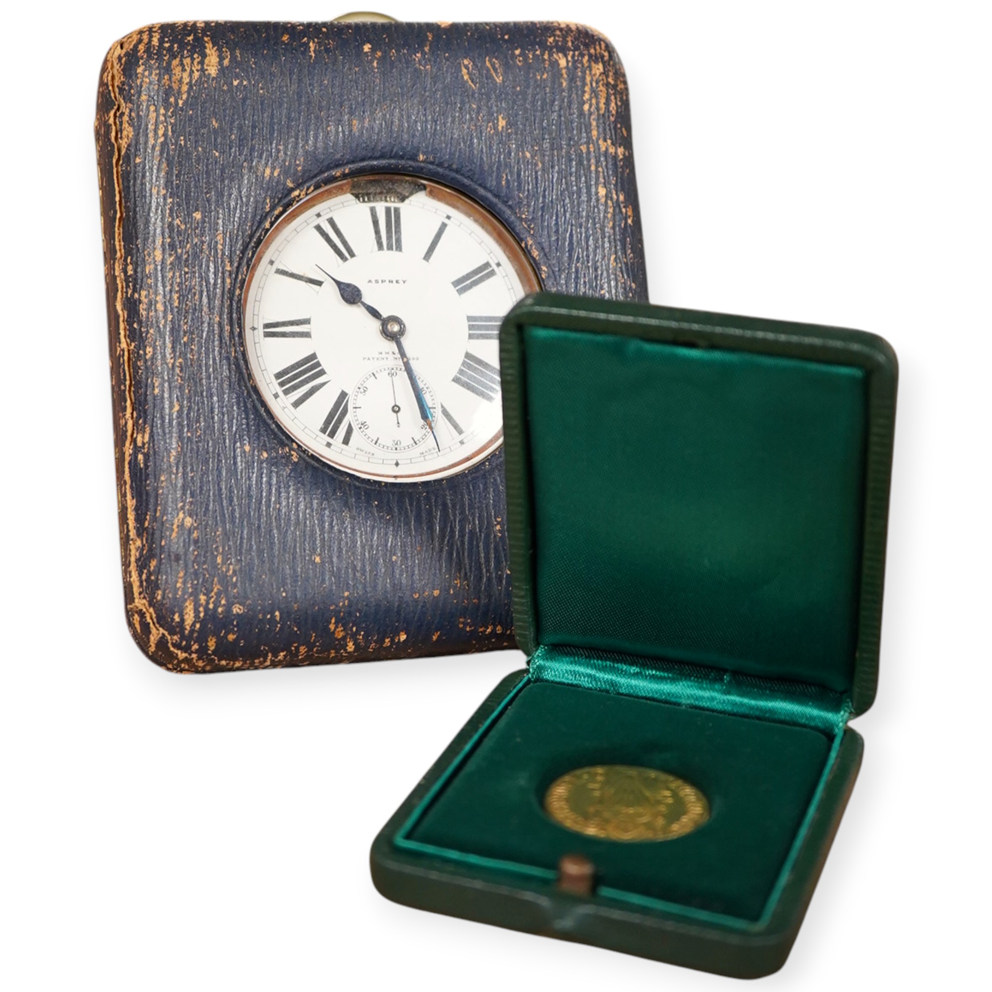 A leather travelling watch case, with nickel case goliath pocket watch, retailed by Asprey, with Roman dial and subsidiary seconds, case diameter 67mm.